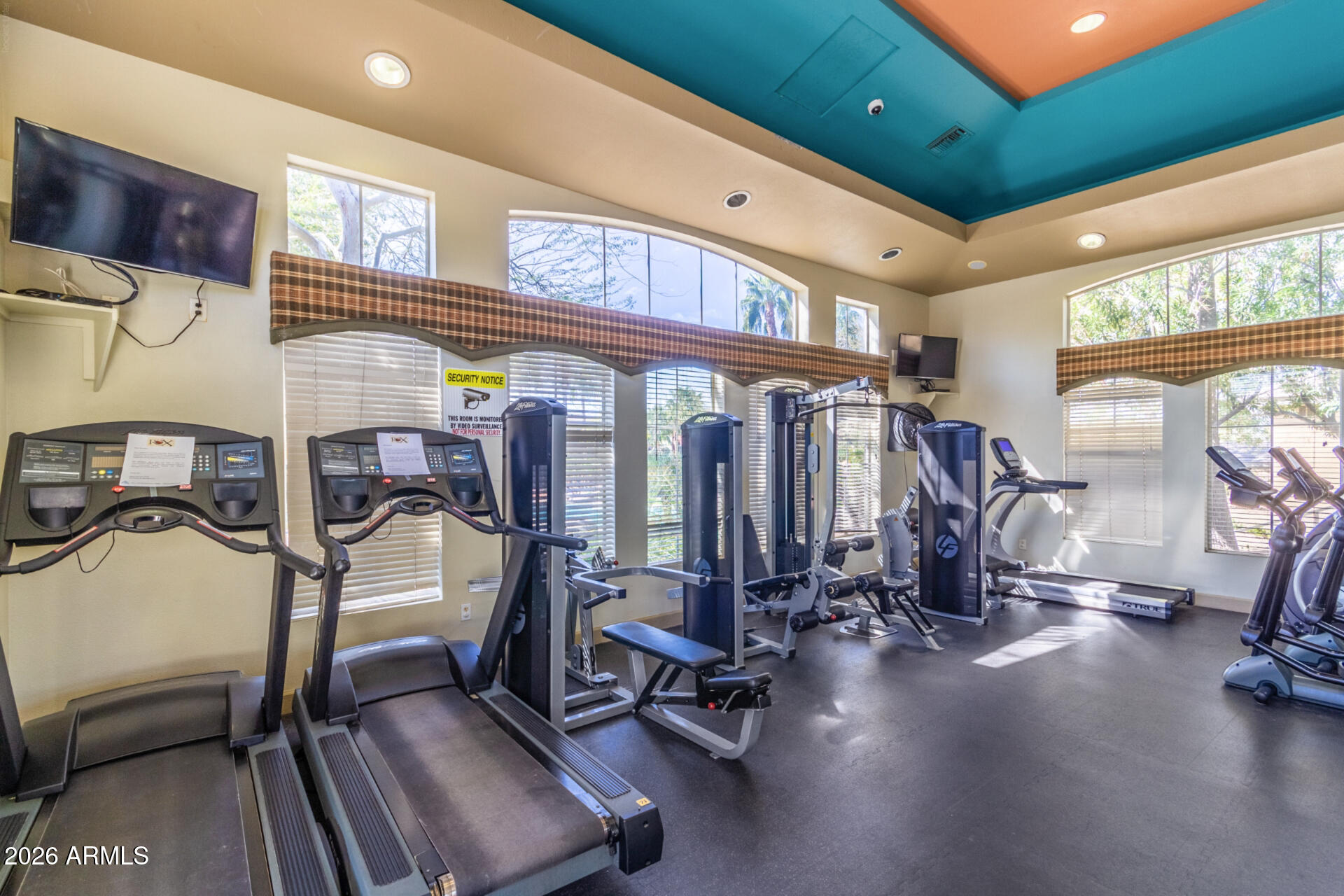 5401 East Van Buren Street, Unit 3017 Phoenix, AZ 85008 - Photo 31 of 37 a view of a room with gym equipment