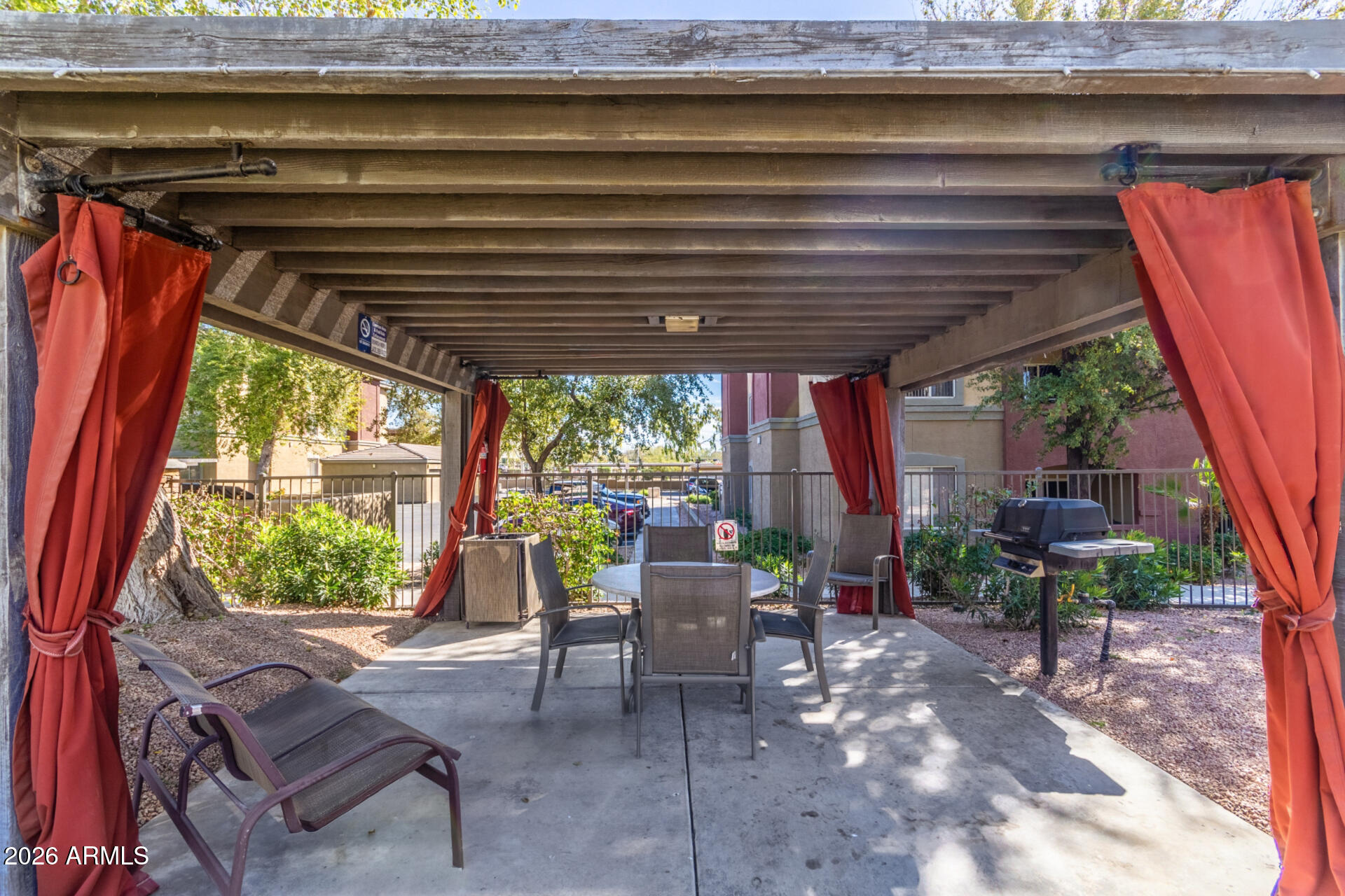5401 East Van Buren Street, Unit 3017 Phoenix, AZ 85008 - Photo 33 of 37 a view of a patio with table and chairs and potted plants