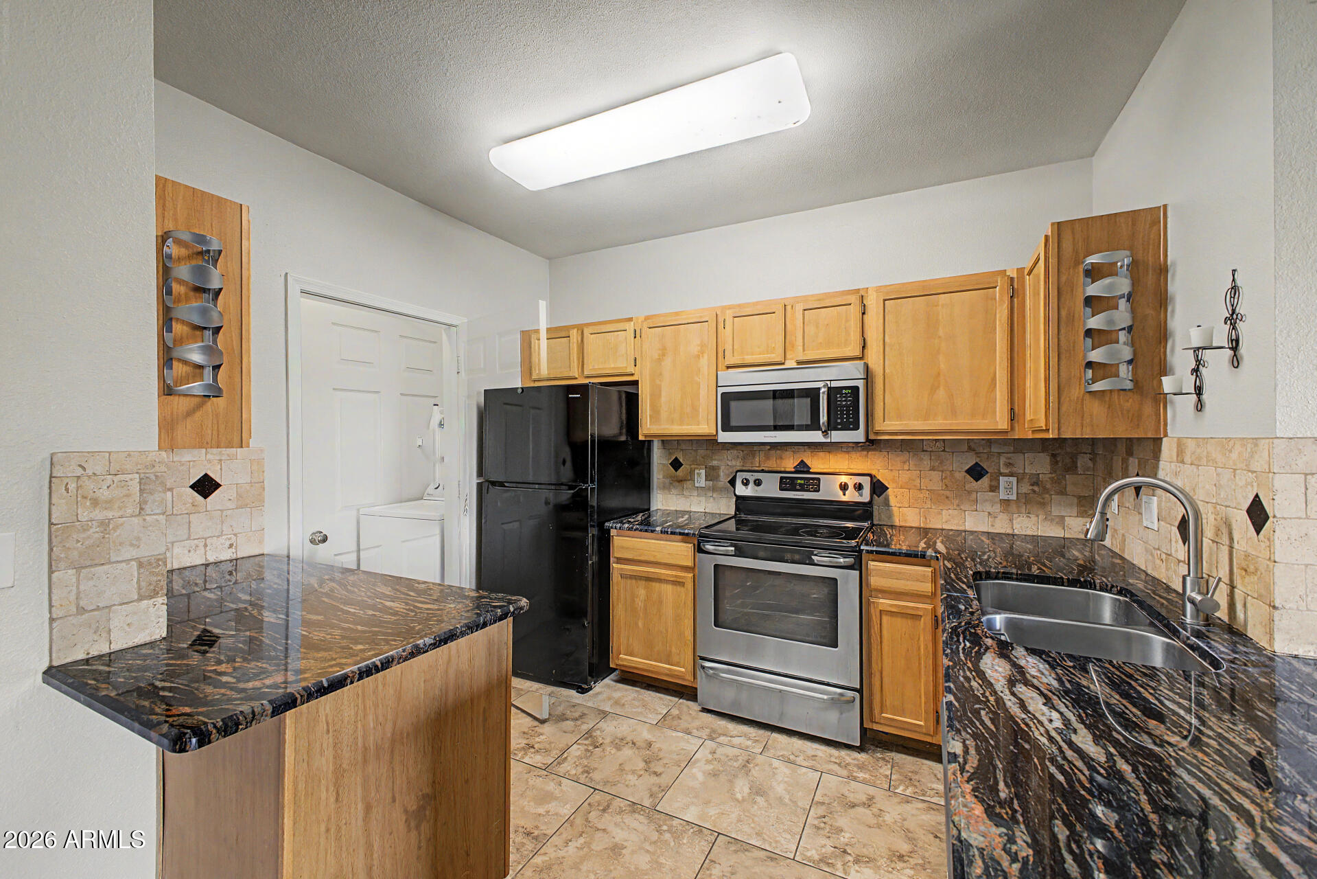 5401 East Van Buren Street, Unit 3017 Phoenix, AZ 85008 - Photo 7 of 37 a kitchen with a sink stove and refrigerator