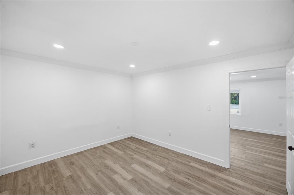 1908 Macomber Avenue Clearwater, FL 33755 - Photo 14 of 24 wooden floor in an empty room