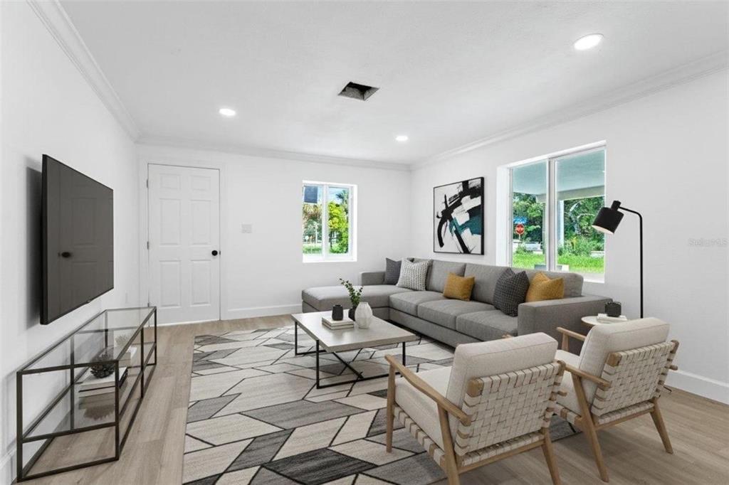 1908 Macomber Avenue Clearwater, FL 33755 - Photo 7 of 24 a living room with furniture and a flat screen tv