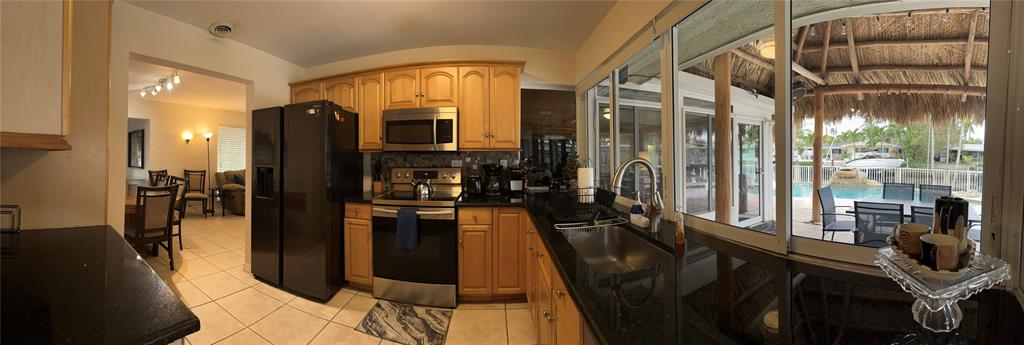 5911 Northeast 15th Avenue Fort Lauderdale, FL 33334 - Photo 14 of 21 a view of a living room with furniture and floor to ceiling window