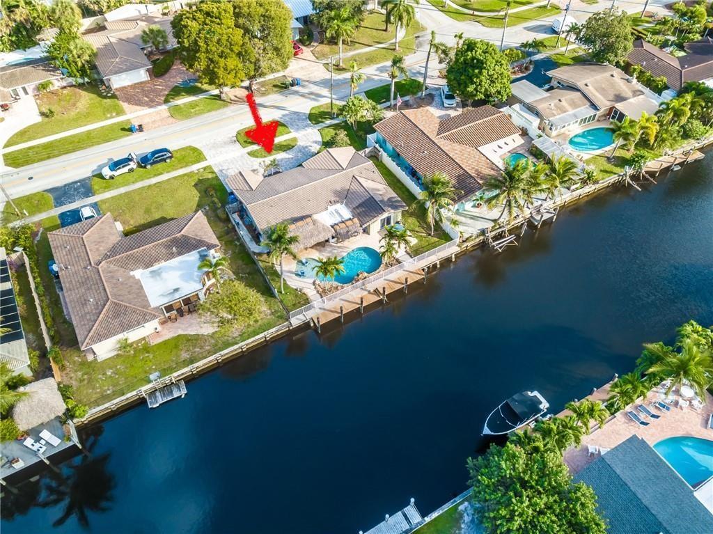5911 Northeast 15th Avenue Fort Lauderdale, FL 33334 - Photo 15 of 21 an aerial view of a house with a lake view