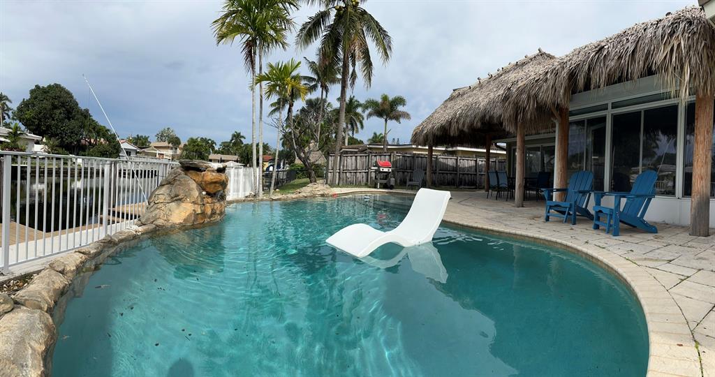 5911 Northeast 15th Avenue Fort Lauderdale, FL 33334 - Photo 16 of 21 a view of a swimming pool with chairs