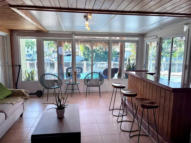 a view of a dining room with furniture window and outside view