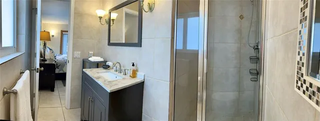 a bathroom with a sink vanity and a mirror