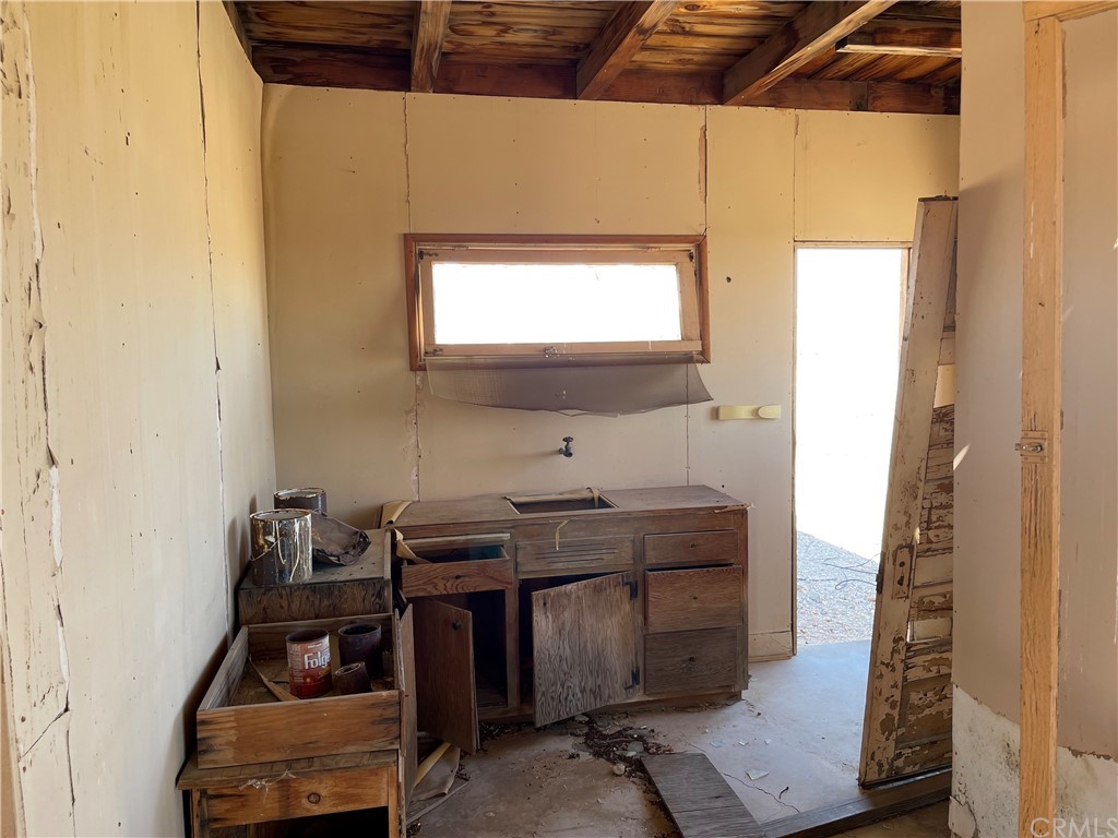 1082 Donavan Twentynine Palms, CA 92277 - Photo 6 of 8 a bathroom with a sink and a mirror
