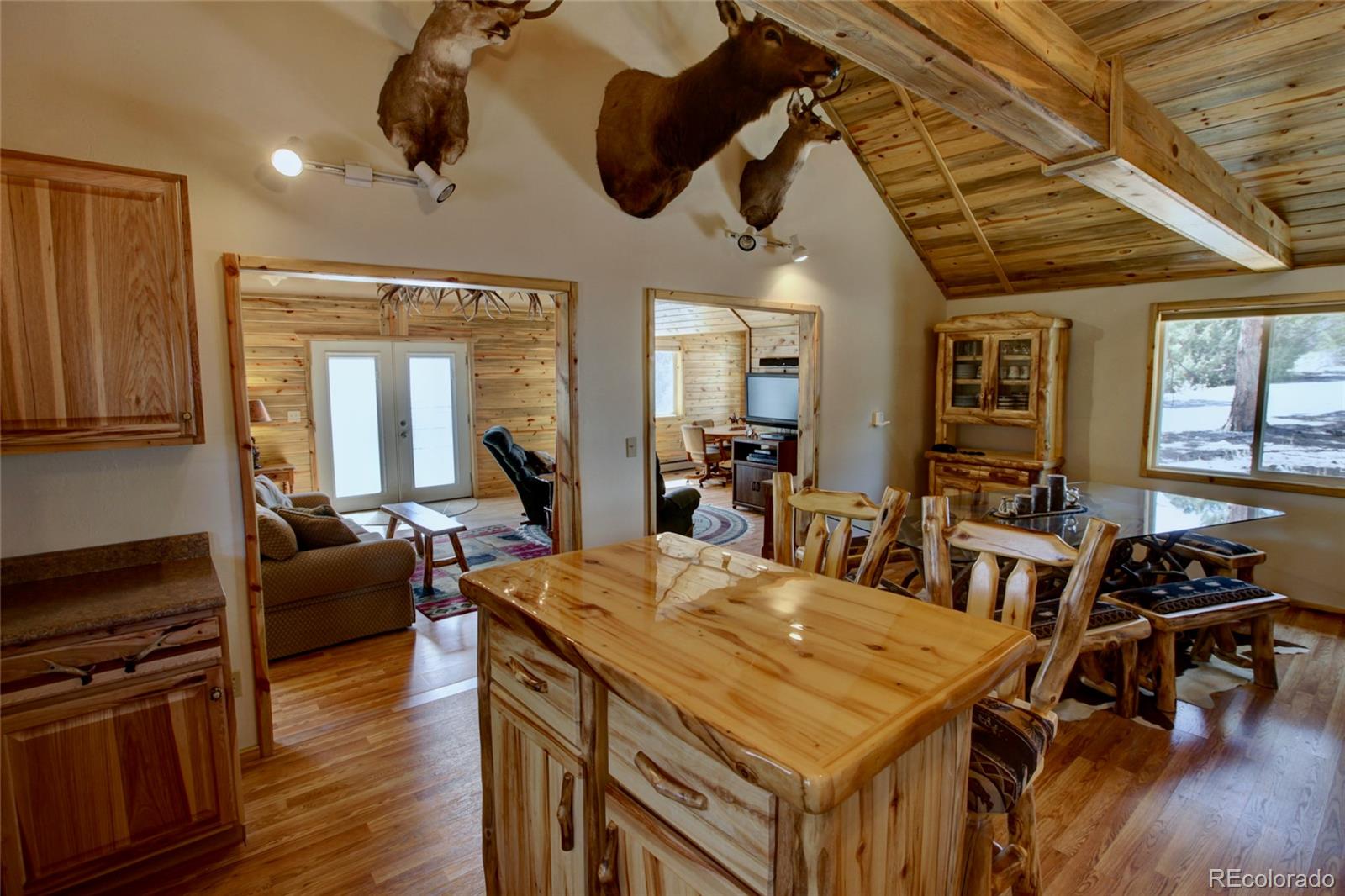530 Red Feather Road Cotopaxi, CO 81223 - Photo 19 of 46 a view of a dining room with furniture wooden floor and chandelier