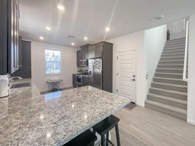 a view of kitchen and windows