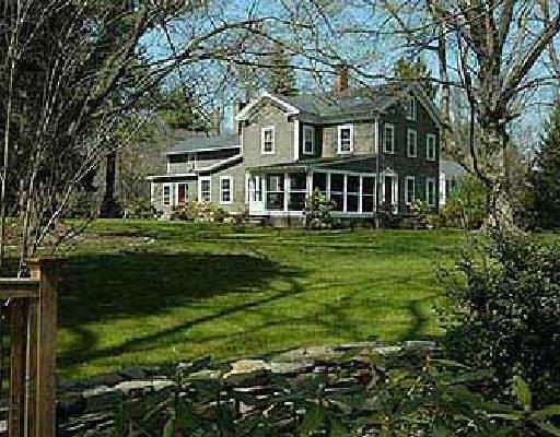 167 Long Lots Road Westport, CT 06880 - Photo 1 of 1 a front view of a house with a garden