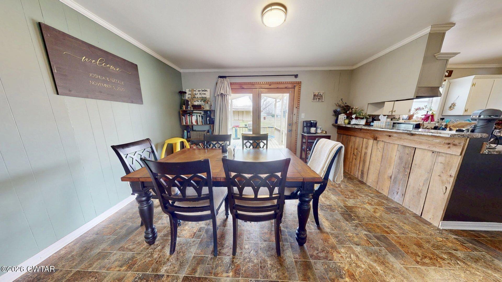 72 Palmer Subdivision Road Dyersburg, TN 38024 - Photo 4 of 14 a view of a dining room with furniture
