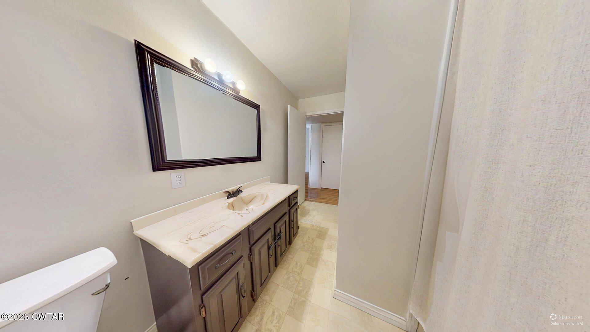 72 Palmer Subdivision Road Dyersburg, TN 38024 - Photo 10 of 14 a bathroom with a sink and a mirror