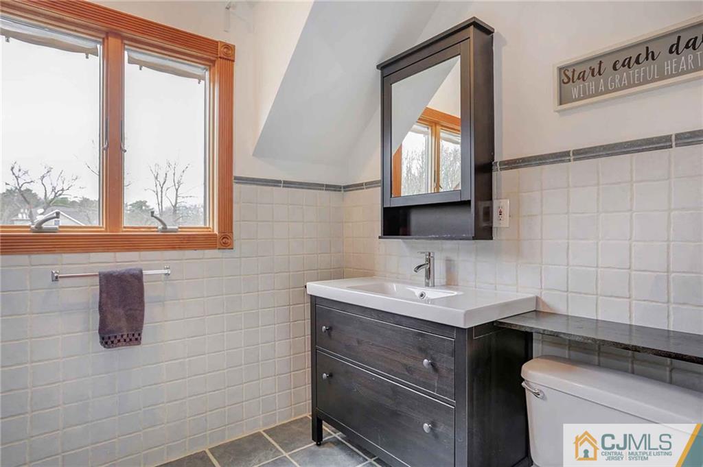 342 Pleasant Valley Road Old Bridge, NJ 08857 - Photo 11 of 25 a bathroom with a sink and a mirror