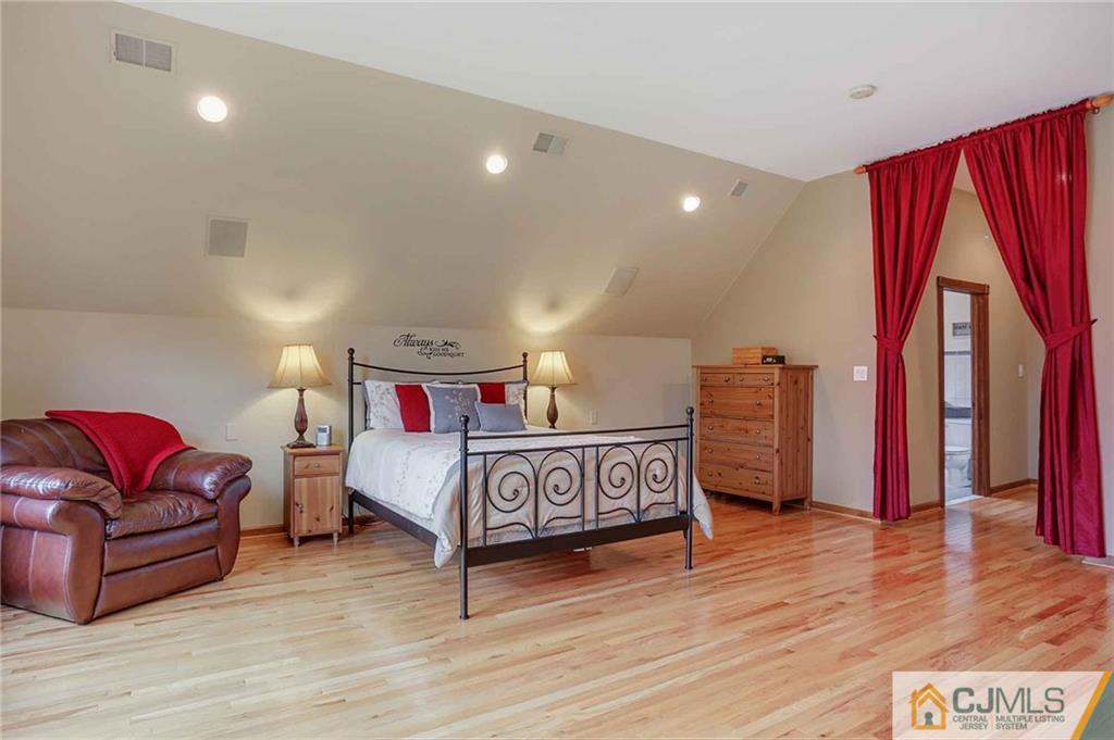 342 Pleasant Valley Road Old Bridge, NJ 08857 - Photo 12 of 25 a bedroom with a bed and a couch
