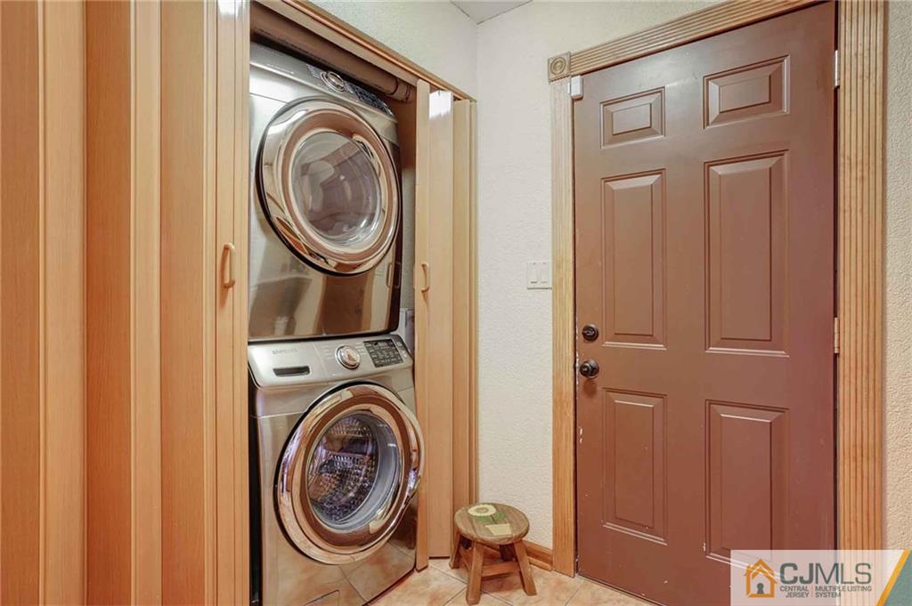 342 Pleasant Valley Road Old Bridge, NJ 08857 - Photo 15 of 25 a utility room with dryer and washer