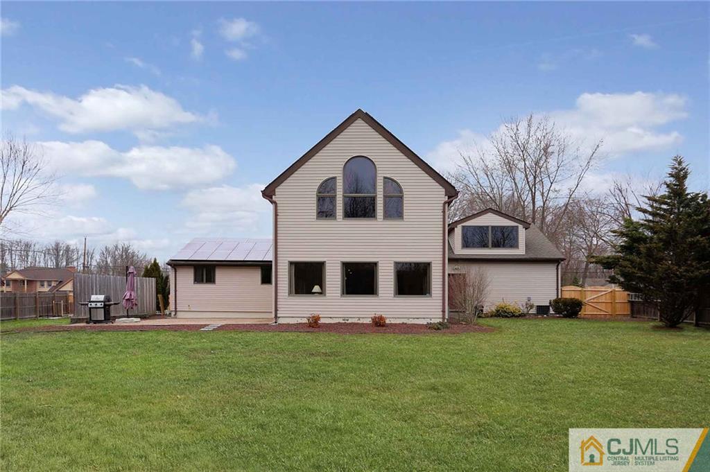 342 Pleasant Valley Road Old Bridge, NJ 08857 - Photo 23 of 25 a front view of a house with a garden and trees