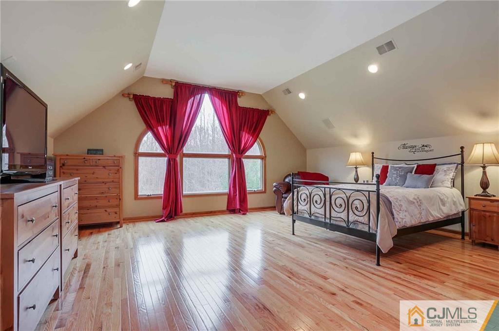 342 Pleasant Valley Road Old Bridge, NJ 08857 - Photo 10 of 25 a bedroom with a bed and a window