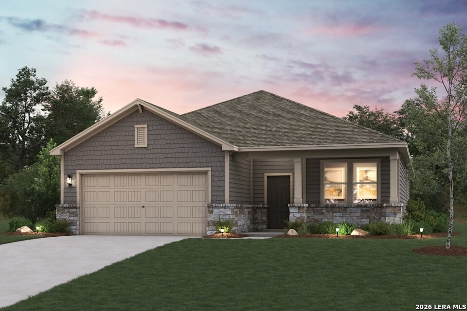 2529 Heritance Pass Seguin, TX 78155 - Photo 1 of 2 a front view of a house with a garden and yard