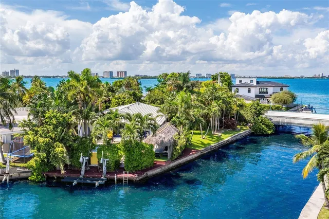 an aerial view of a house with a garden and plants