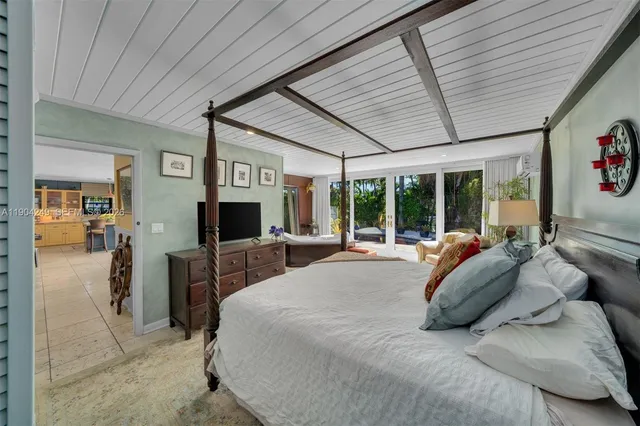 an aerial view of a houses with a lake