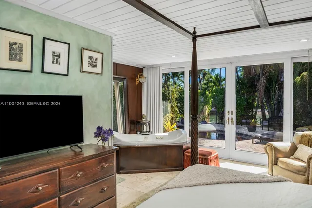 a view of a lake with lawn chairs