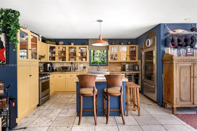 an aerial view of a houses with a lake view