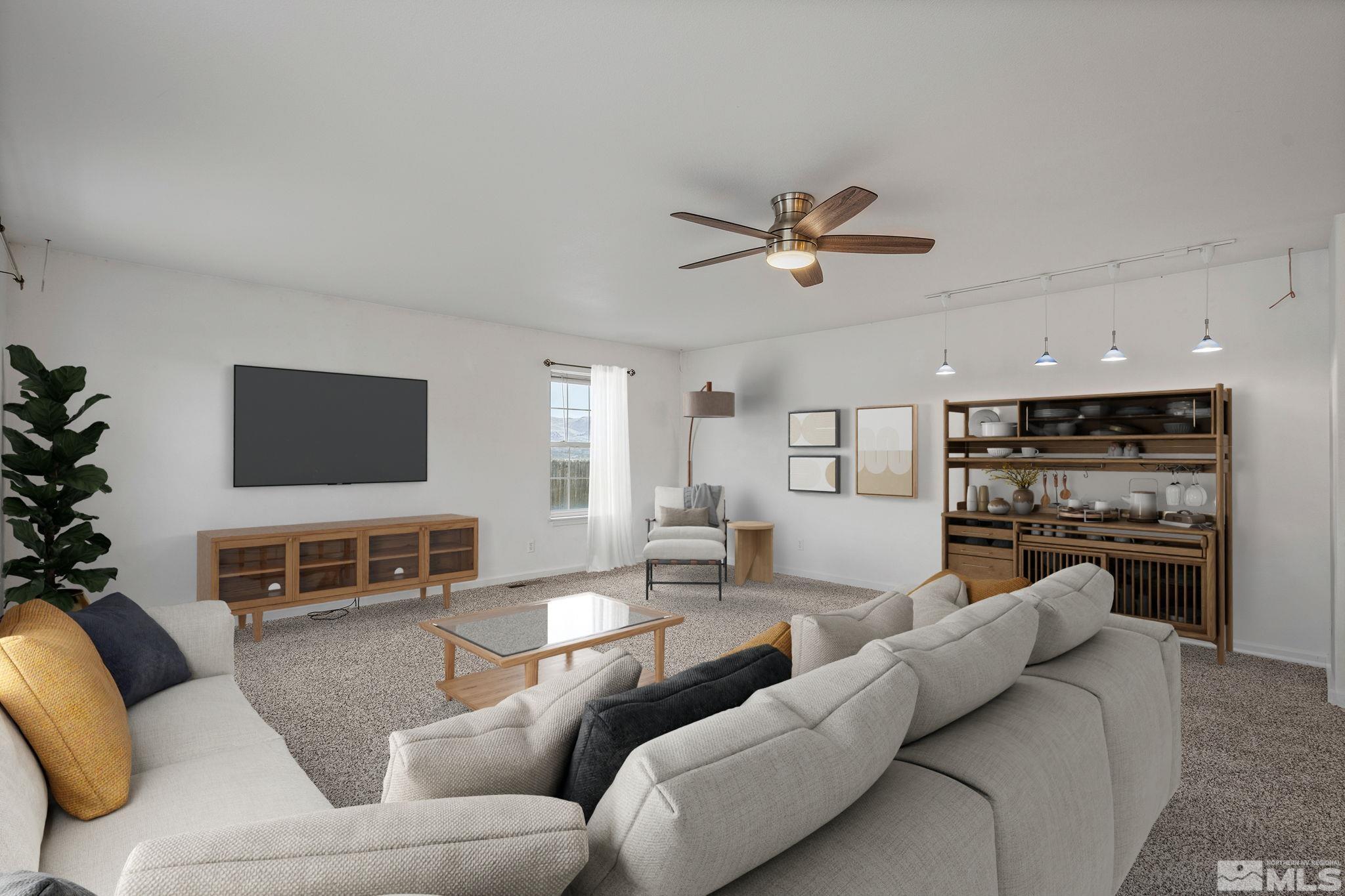 15560 North Red Rock Road Reno, NV 89508 - Photo 11 of 28 a living room with furniture kitchen view and a fireplace