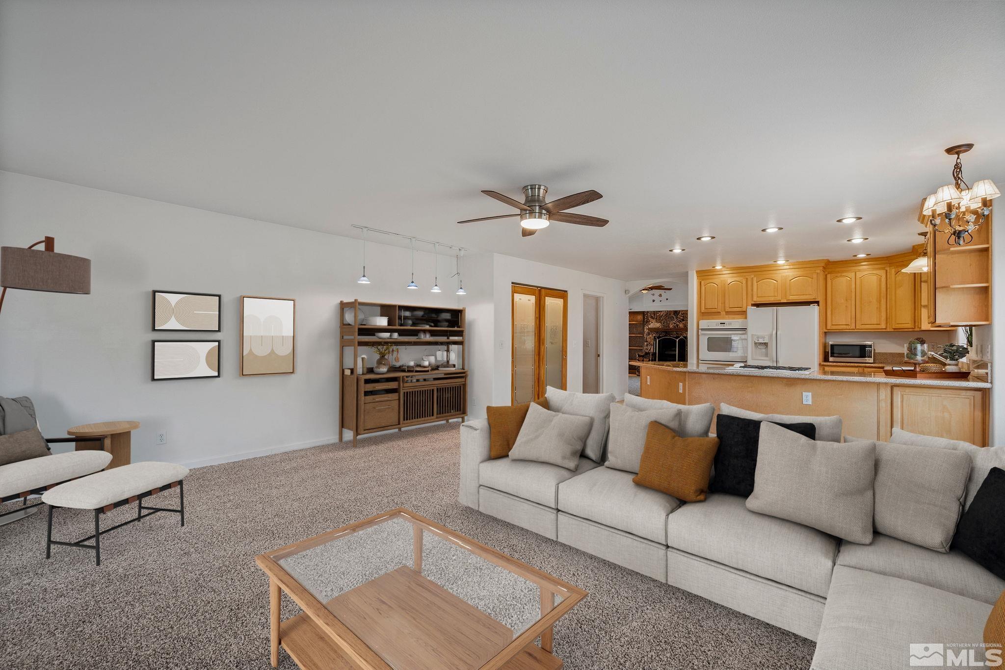 15560 North Red Rock Road Reno, NV 89508 - Photo 9 of 28 a living room with furniture and kitchen view