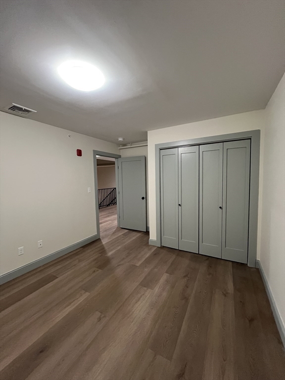 160 Seabury Street, Unit 31 Fall River, MA 02720 - Photo 11 of 14 a view of an empty room with wooden floor