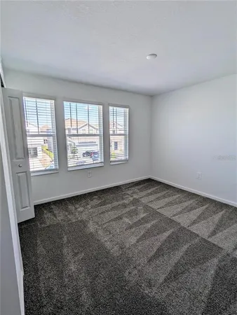 a view of a room that has a window in it