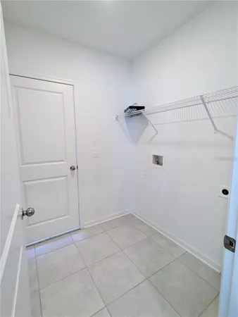 a view of water heater room with a garage