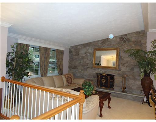 600 Moon Ridge Freedom, PA 15042 - Photo 2 of 18 Living Room. Home has an open floor plan. New oak railings and spindles. Stone wall with a wood burning F.P.