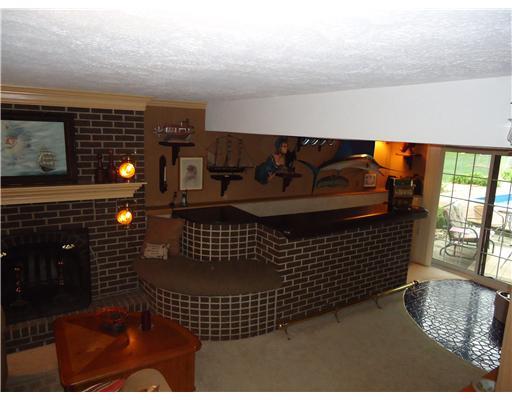 600 Moon Ridge Freedom, PA 15042 - Photo 12 of 18 Den/Family/Great Room. sliding glass doors leading to a back yard oasis and a built in bar make this the perfect place for entertaining.