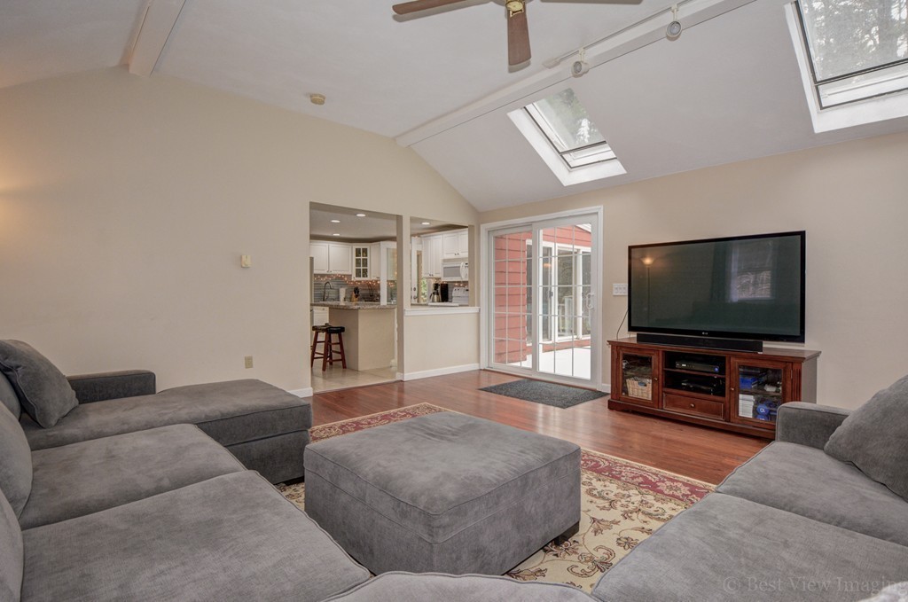 86 Harvard Road Stow, MA 01775 - Photo 10 of 19 a living room with furniture and a flat screen tv