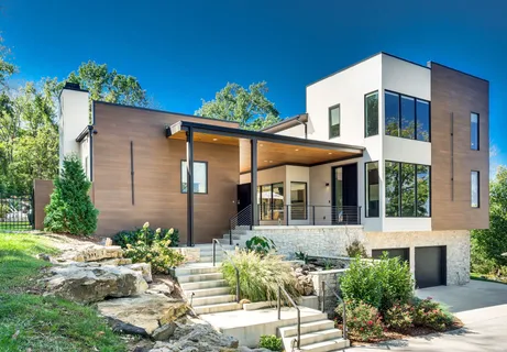 front view of a house with potted plants