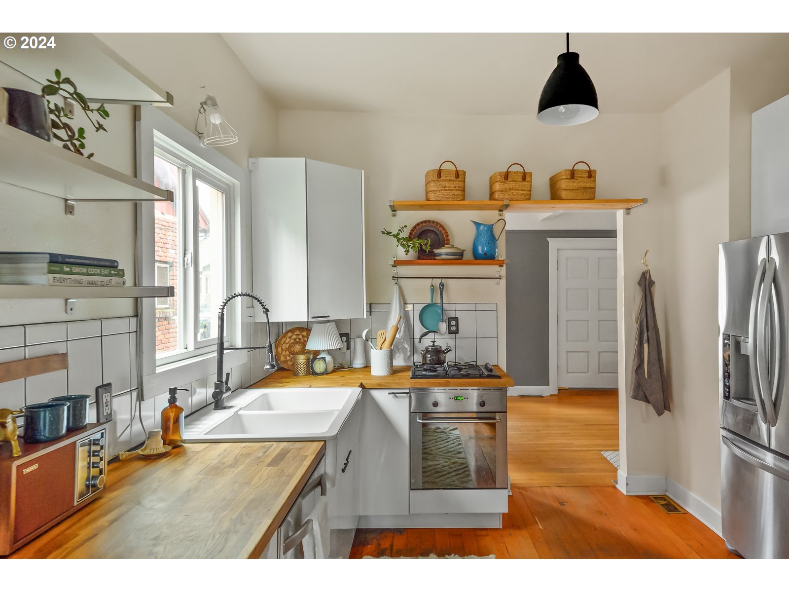 1518 North Webster Street Portland, OR 97217 - Photo 12 of 38 a kitchen with sink refrigerator and stove