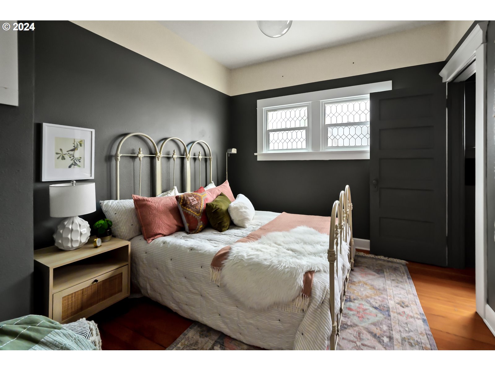 1518 North Webster Street Portland, OR 97217 - Photo 18 of 38 a bedroom with a bed and a window
