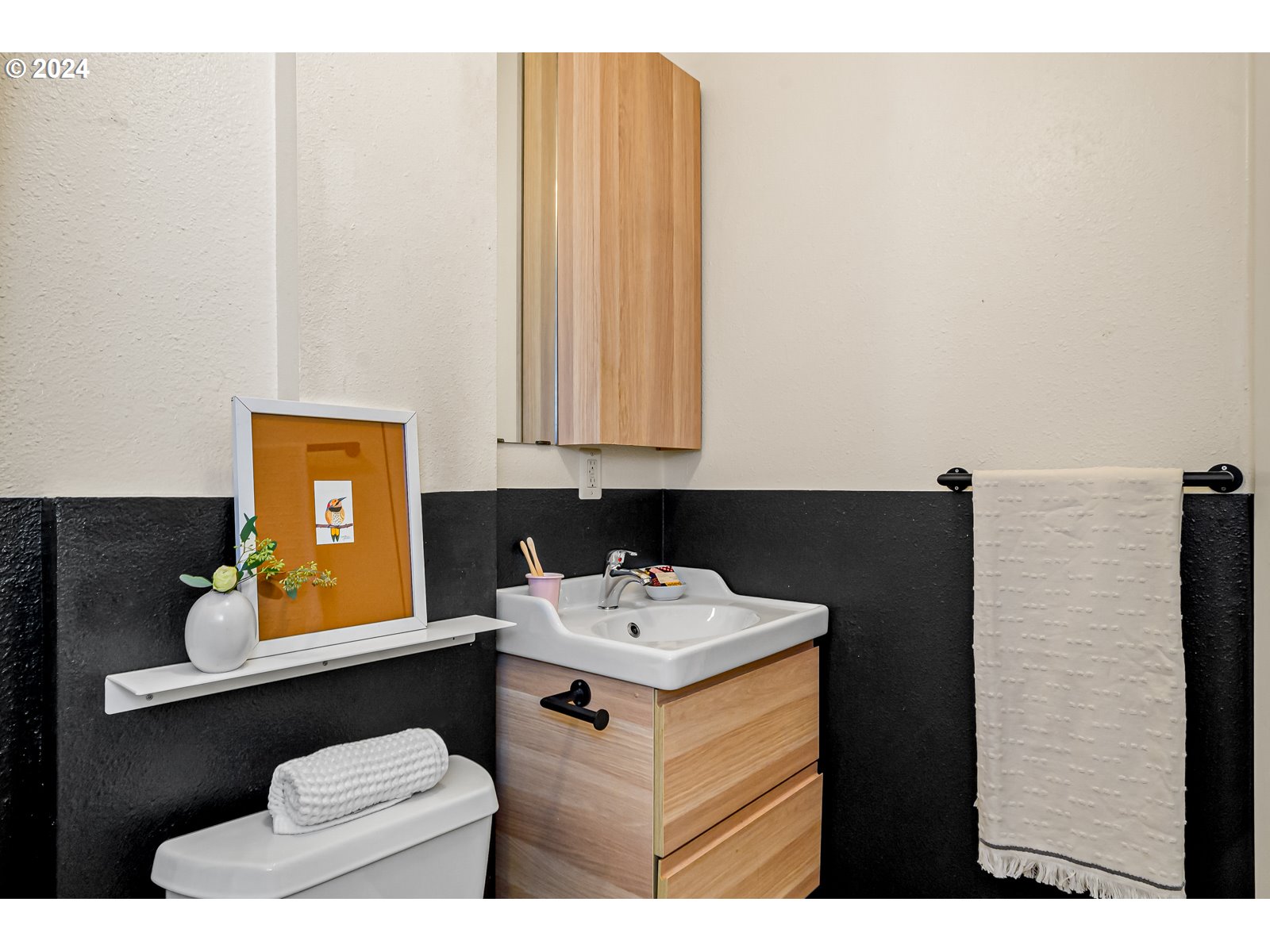 1518 North Webster Street Portland, OR 97217 - Photo 20 of 38 a bathroom with a sink vanity and a mirror