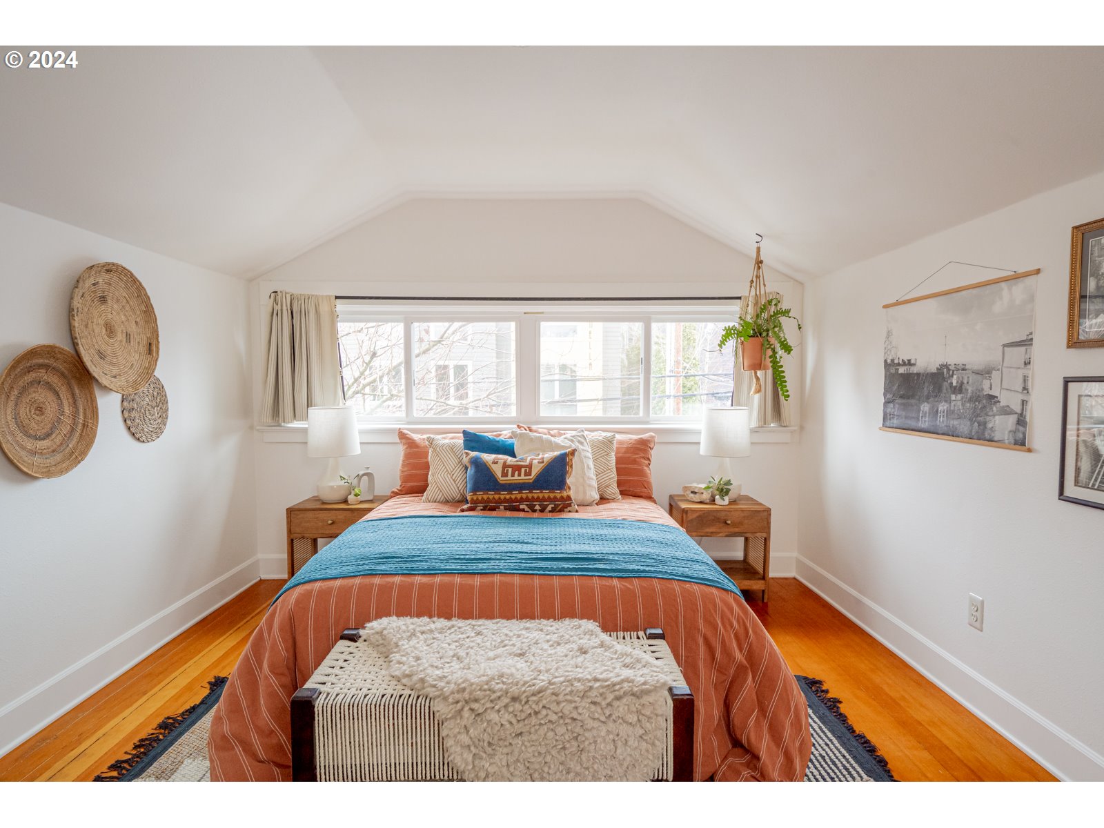 1518 North Webster Street Portland, OR 97217 - Photo 27 of 38 a bedroom with a bed a dresser and windows