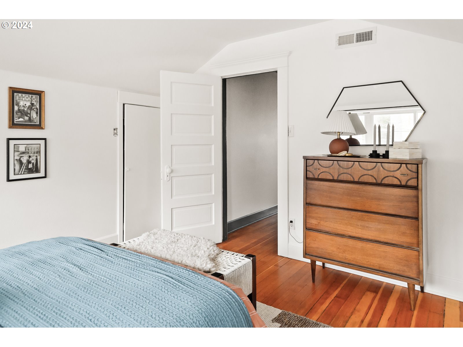 1518 North Webster Street Portland, OR 97217 - Photo 29 of 38 a bedroom with a bed and a mirror
