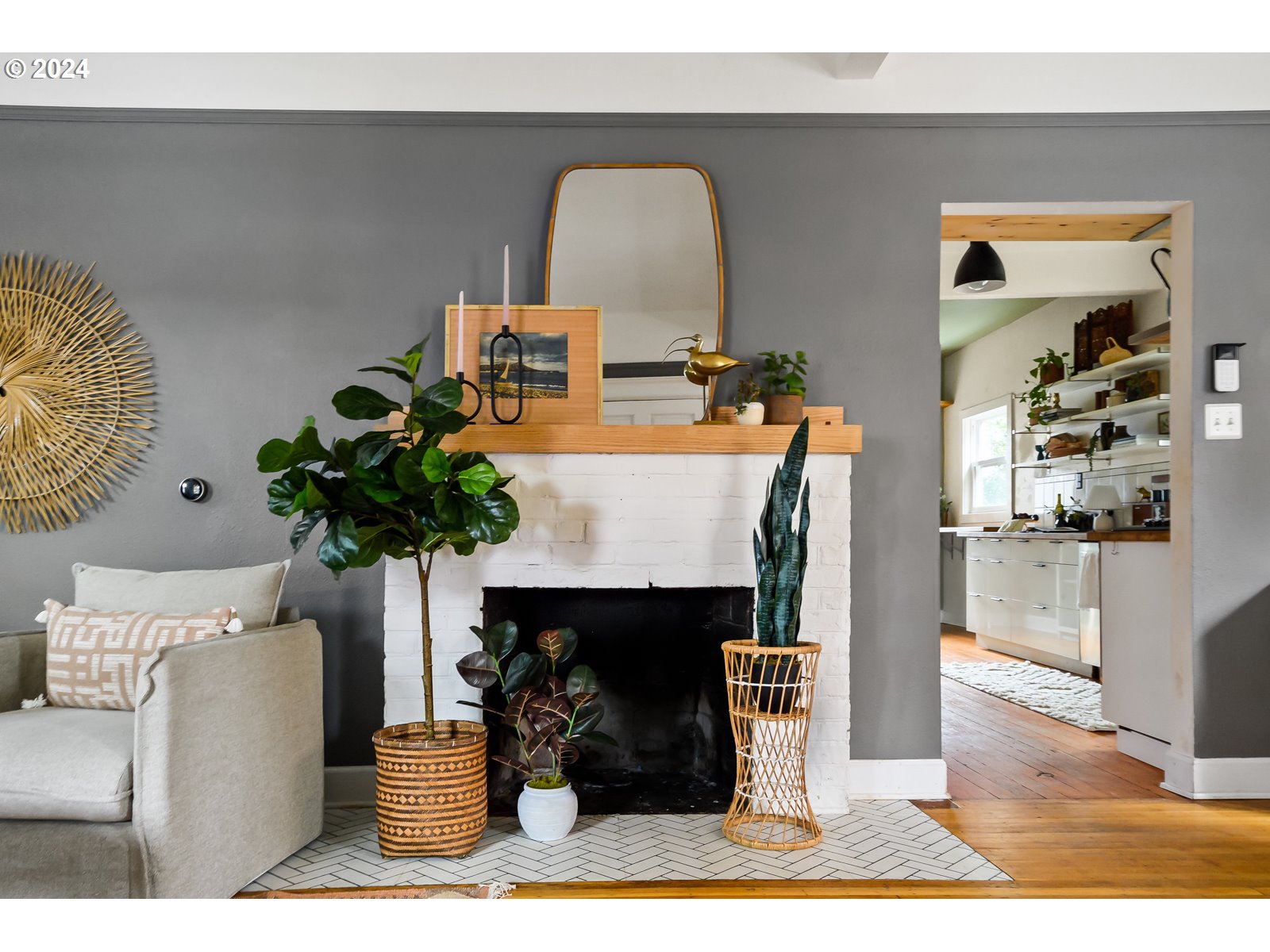 1518 North Webster Street Portland, OR 97217 - Photo 3 of 38 a vase of flowers sitting on a table with a fireplace