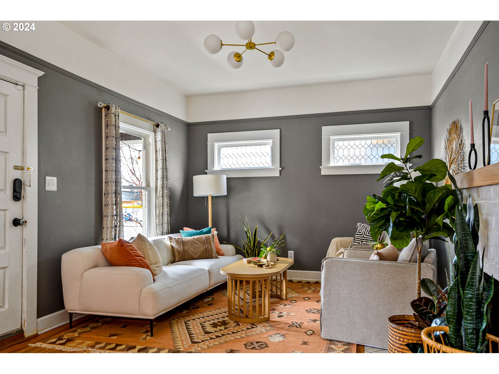 1518 North Webster Street Portland, OR 97217 - Photo 4 of 38 a living room with furniture and a potted plant