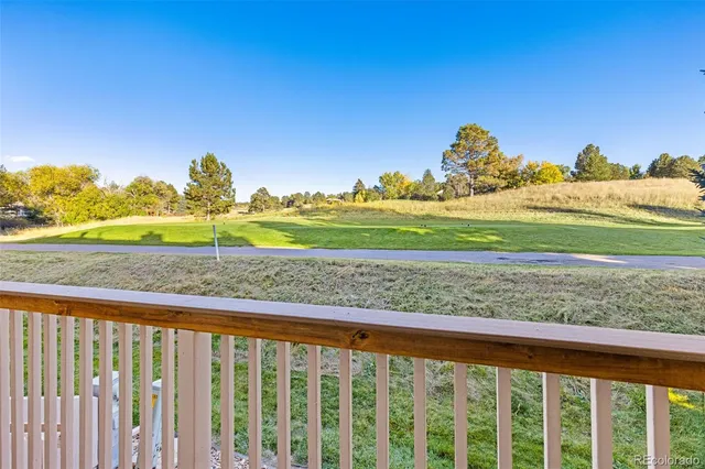 a view of a field with mountains in the background