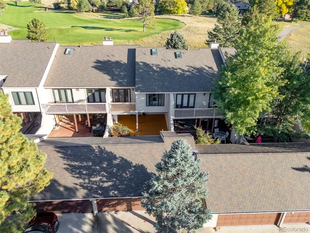 an aerial view of a house with a yard basket ball court and outdoor seating