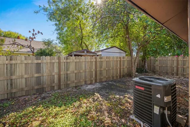 a view of a backyard with a swing