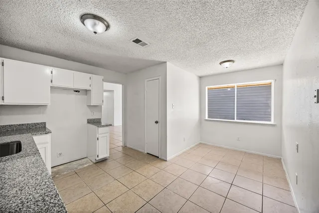 a view of kitchen with furniture and window