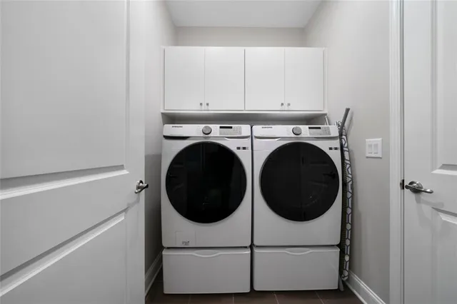 a utility room with dryer and washer