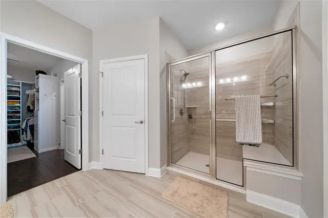 a bathroom with a glass shower door