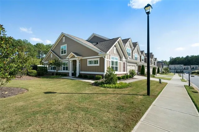 a front view of a house with garden