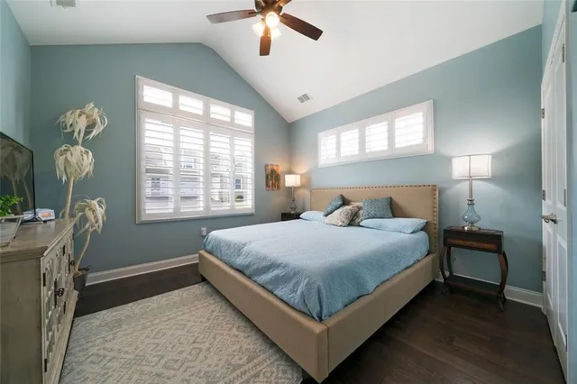 a bedroom with bed and window